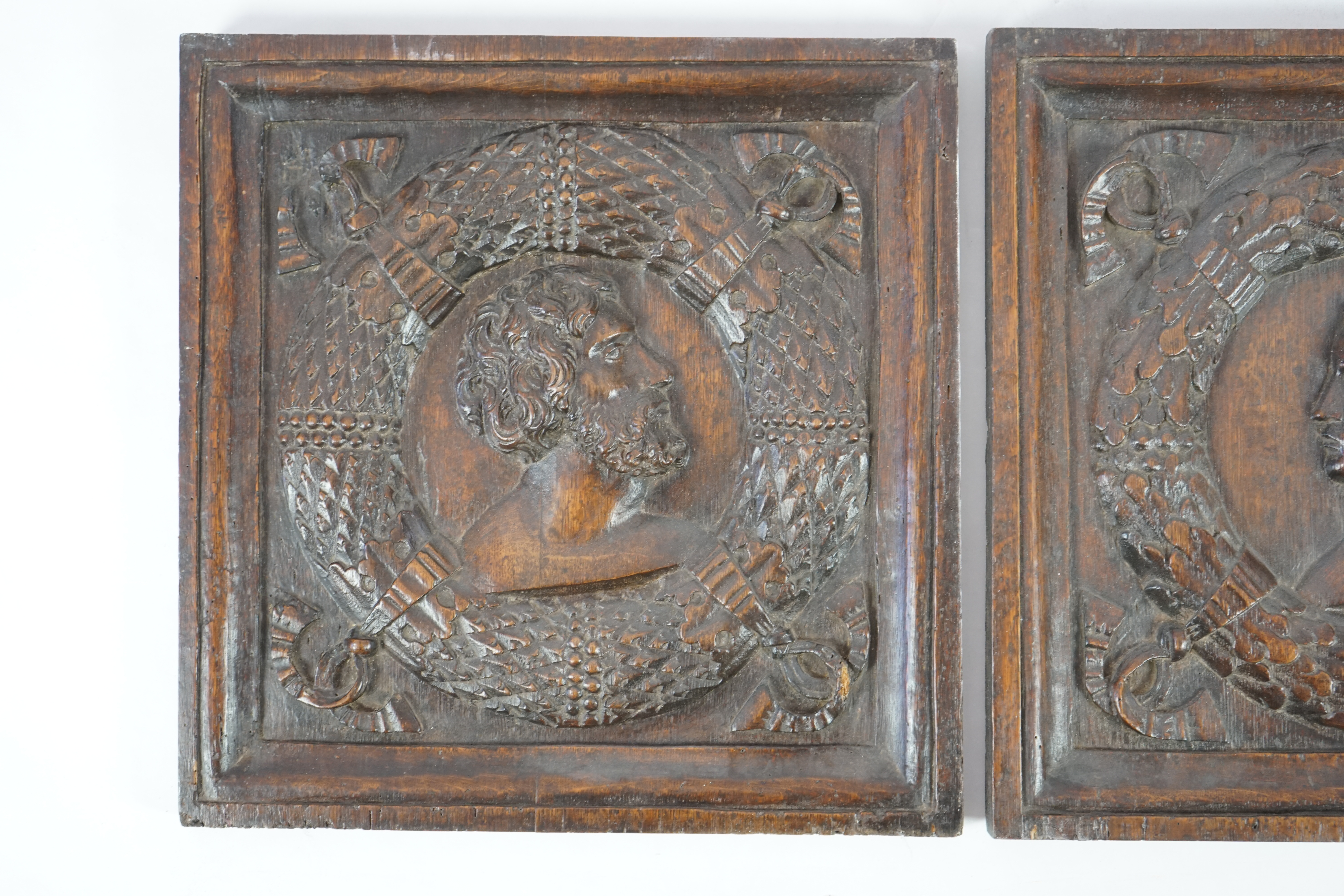 A pair of 17th century carved oak panels